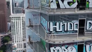 a plan to clean the graffiti off the Oceanwide Plaza towers in downtown Los Angeles. .