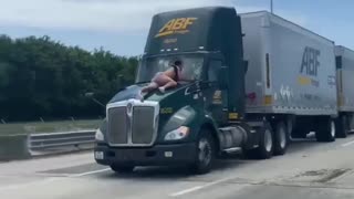 Viral video shows Florida man jump, hold onto the hood of a moving semi-truck
