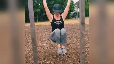 Horizontal bar crunches in the outdoor park