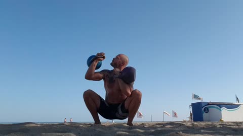 Alternate double pressing with kettlebells