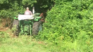 Clearing brush and Logs with the Tractor