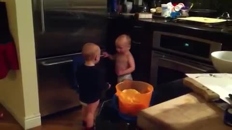 Twin baby boys have a conversation