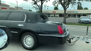 Limo Hauling a Speed Boat
