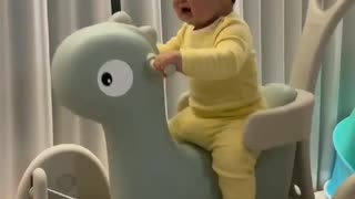 Baby playing with funny toy