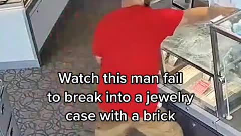 Watch this man fail to break into a jewelry case with a brick