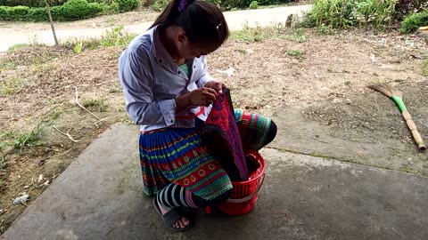 H'moong ethnic women are embroidering their ethnic dress.