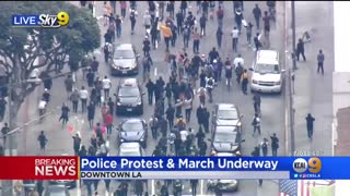 Police clash with protesters in downtown Los Angeles