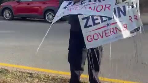 New York Woman in Police Uniform Takes Down "Lee Zeldin for Governor" Signs