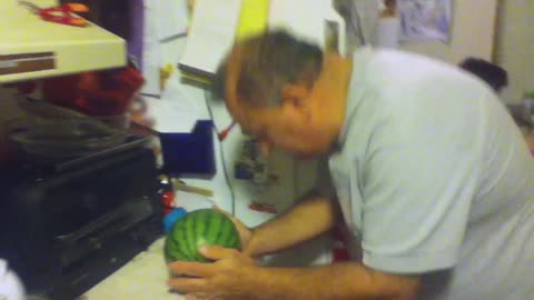Man tries to break watermelon with his head