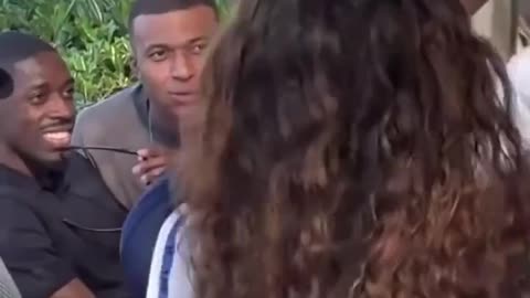 Kylian Mbappe Caught Mesmerized by a Woman Waving a France Flag
