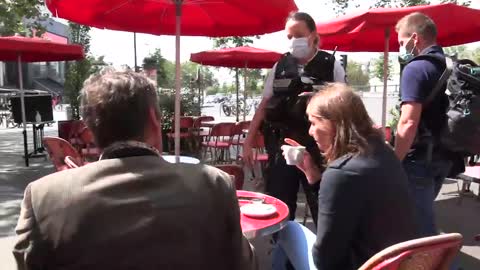 French police casually checking vaccine passports.