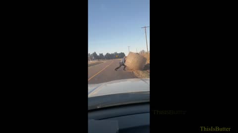 Dashcam shows Missouri State trooper moves massive hay bale out of road