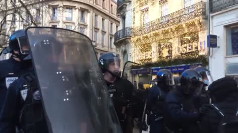 Paris France - protesters launching tear gas all over the streets