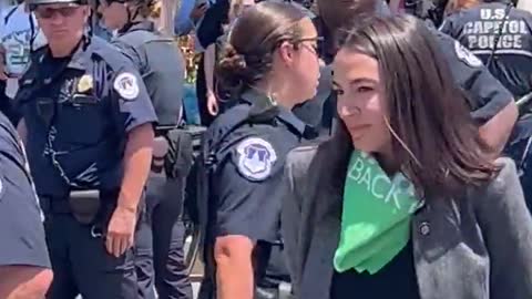 LOL: AOC PRETENDS To Be Handcuffed at Protest