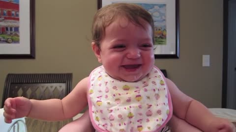 Adorable baby laughs hysterically at her sister