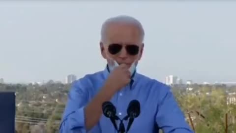 Joe Biden Pulls Down Mask to Cough