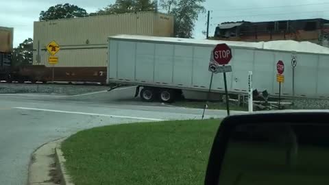 Semi-Truck Stuck on Tracks