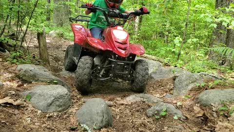 Shorty Rock crawling his 4 wheeler