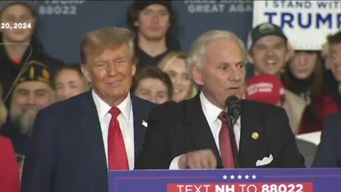 Trump onstage at a campaign rally in Manchester