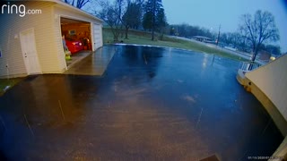 Woman's Surprise Sip on Icy Driveway