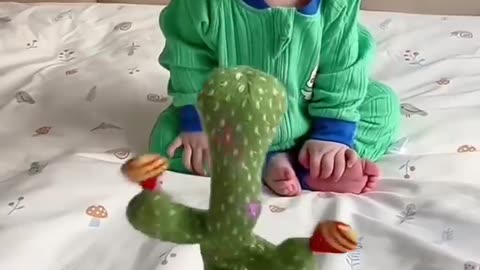 Cuteness Overload! 🌵👶 Babies Unleash Hilarity with Dancing Cactus Toy 🎉😂