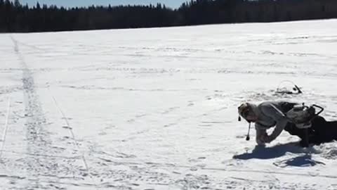 Man ice drill floor faceplant