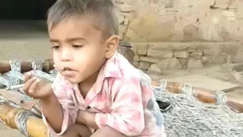 Funny Indian small boy smoking