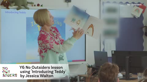 Teacher tells 10-year-olds about how an unhappy boy teddy became a happy girl teddy in a lesson from
