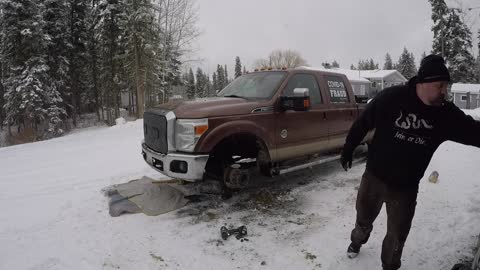 Rotating the tires on the old Sherman F350. The Covid Truck