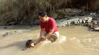 Country Kids Playing on The River