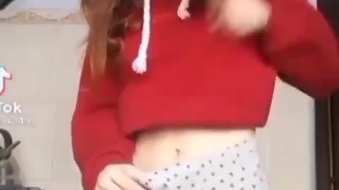 Girl timidly trying to put hands into her pants