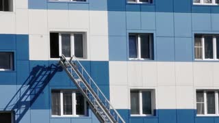 Rescuers Save Child from Falling from Open Window