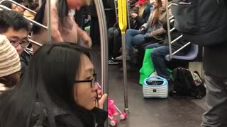 Man with donald trump mask acts crazy with baby stroller on subway train