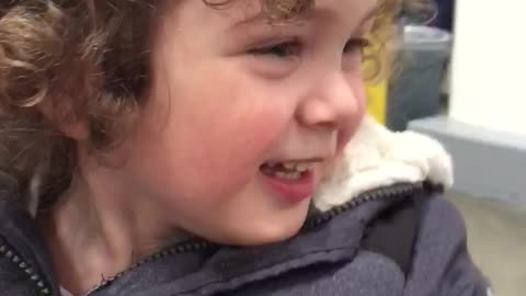 Happy Young Boy Saying Hello To Fellow Shoppers