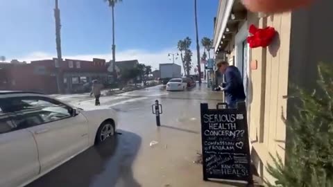 Massive waves flood California beach