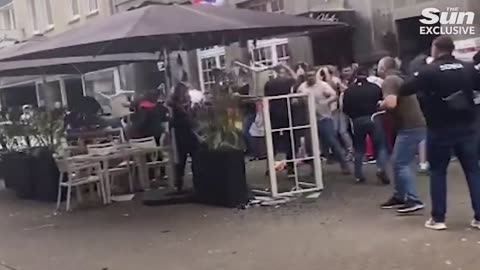 Moment England & Serbia fans launch chairs in bloody clash ahead of Euros match