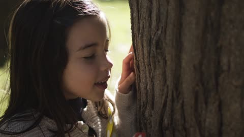 Close Up Video of a Girl Playing Hide and Seek