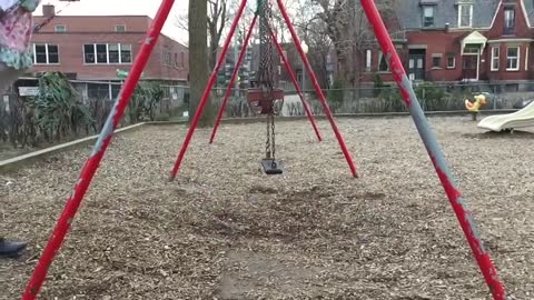 Awesome dad perfects swing stunt at park
