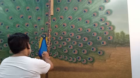 My big brother depicting the world's biggest oil painting of dancing peacock