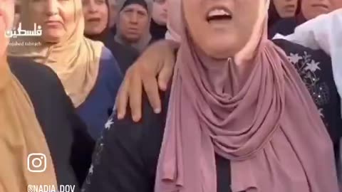 A Palestinian mother celebrates after receiving the news that her son became a “martyr”