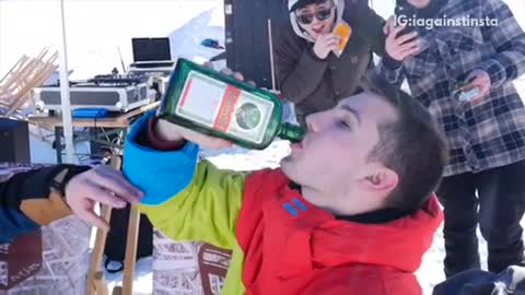 Guy downs bottle of jager and then goes snowboarding and reverse scorpions