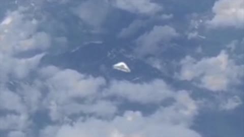 Airline Passenger Films Apparent UFO Over The Alps