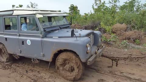 Elephant towing a broken Landrover, again