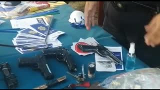 A video of law enforcement officers who had confiscated weapons and drugs at schools