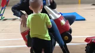 Lady Gets Stuck in Toy Car