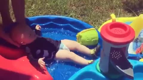 Collab copyright protection - baby slides down waterslide