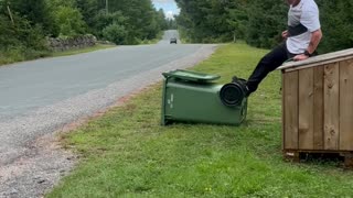 Raccoons Refuge In Garbage Bin