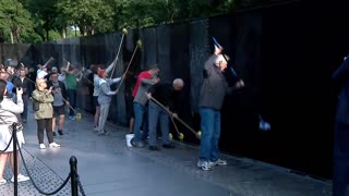 Bipartisan lawmakers, volunteers hand wash Vietnam Veterans Memorial