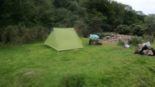 putting up a lightweight trekking pole tent. riverside wildcamping