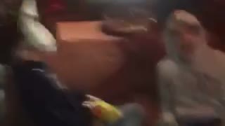 Man on couch pied in face